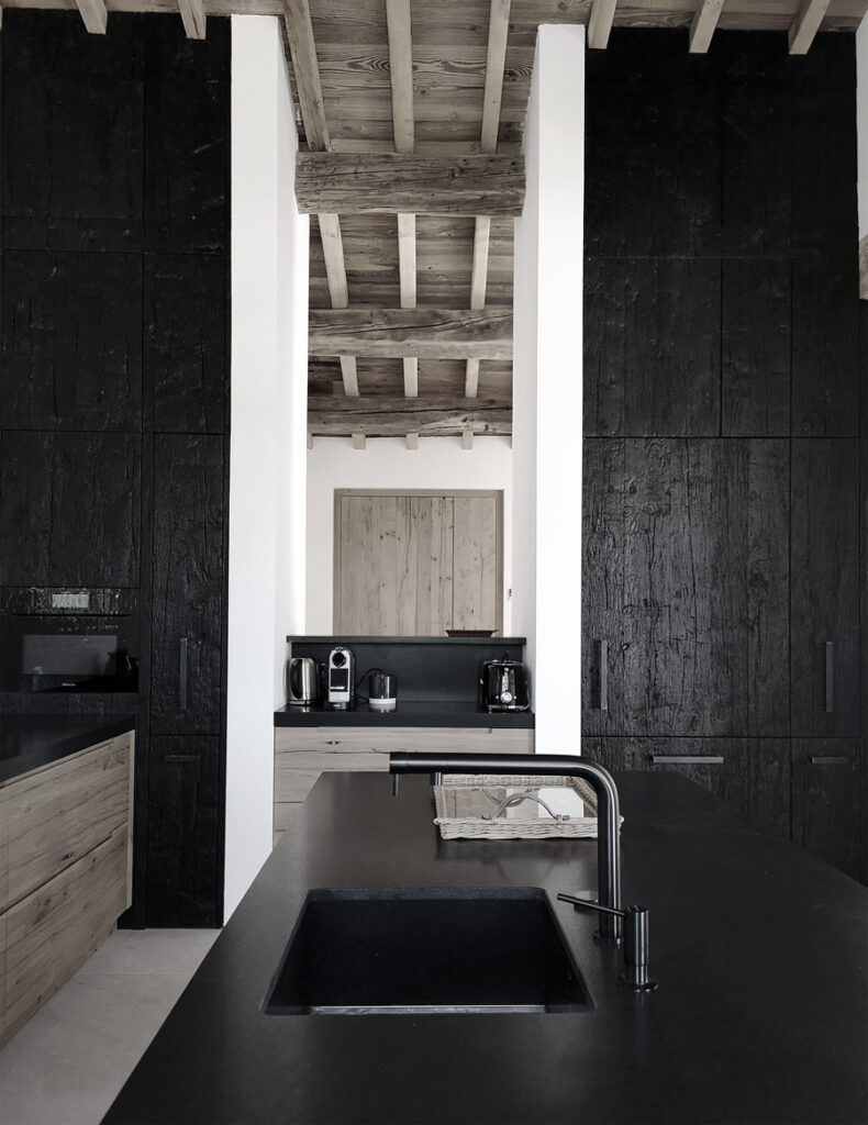 kitchen in burnt wood and old planed oak