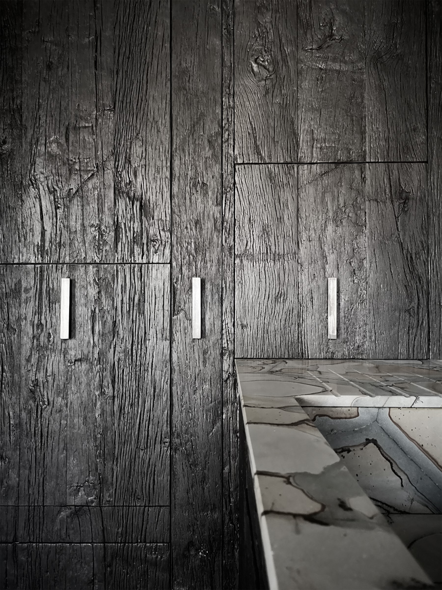 kitchen in burnt wood and Brazilian stone